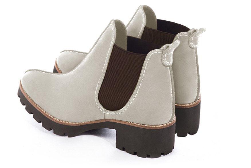 Women's off white and chocolate brown elegant Chelsea ankle boots, with side elastics. Round toe. Thick rubber soles - Rear view